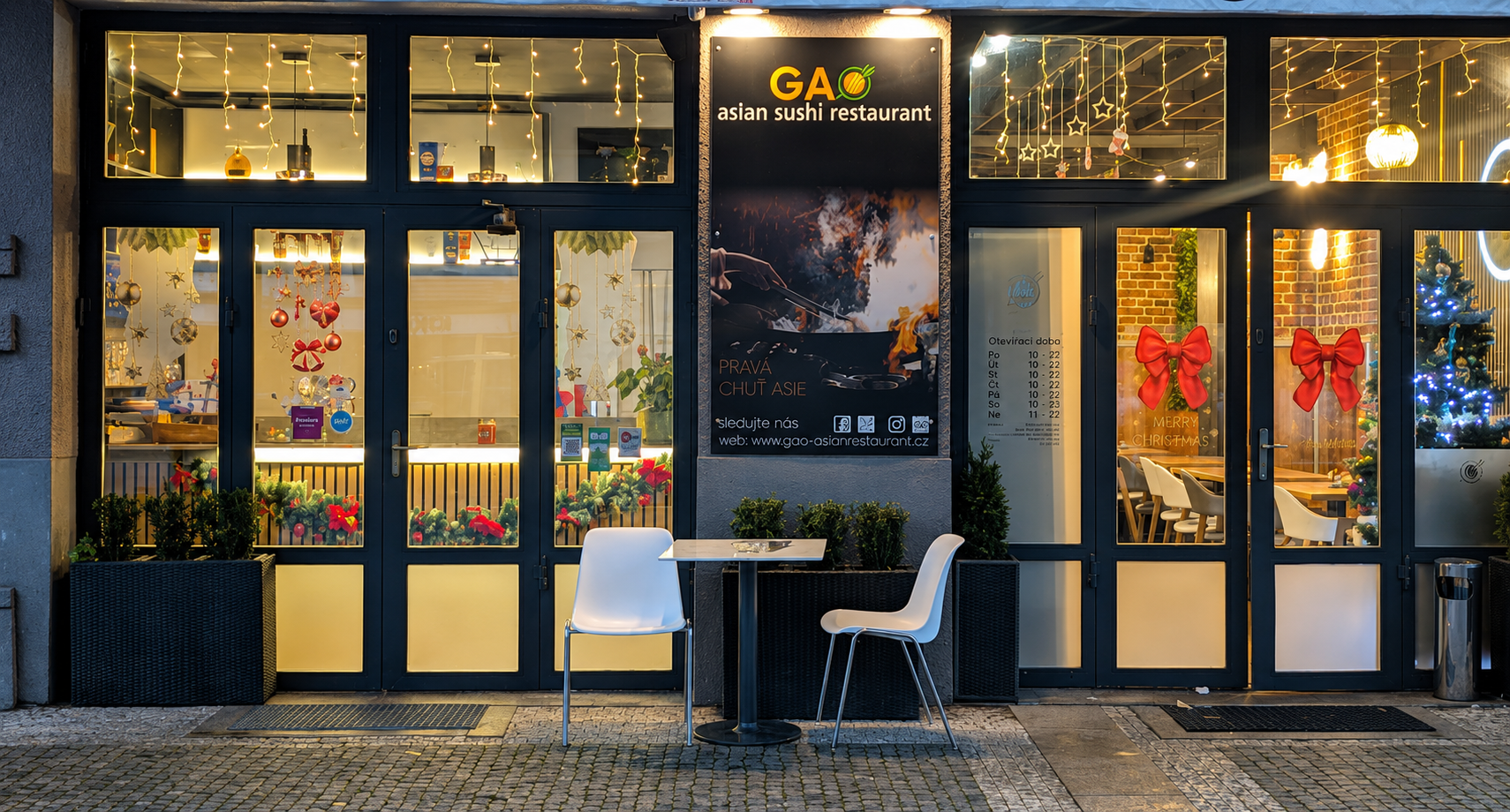 Warm and inviting restaurant interior with decorative lighting and artistic wall patterns.